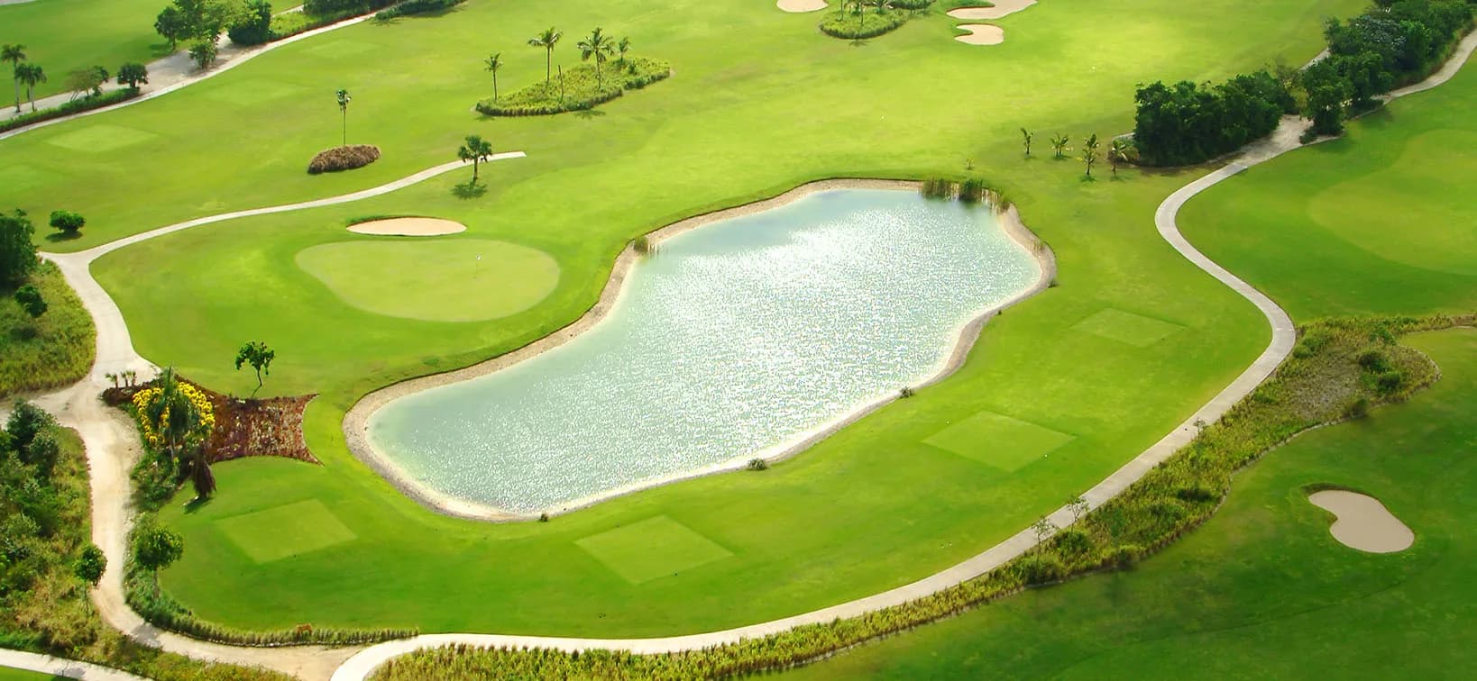 Aerial of lake-guarded fairways at Punta Blanca Golf Club