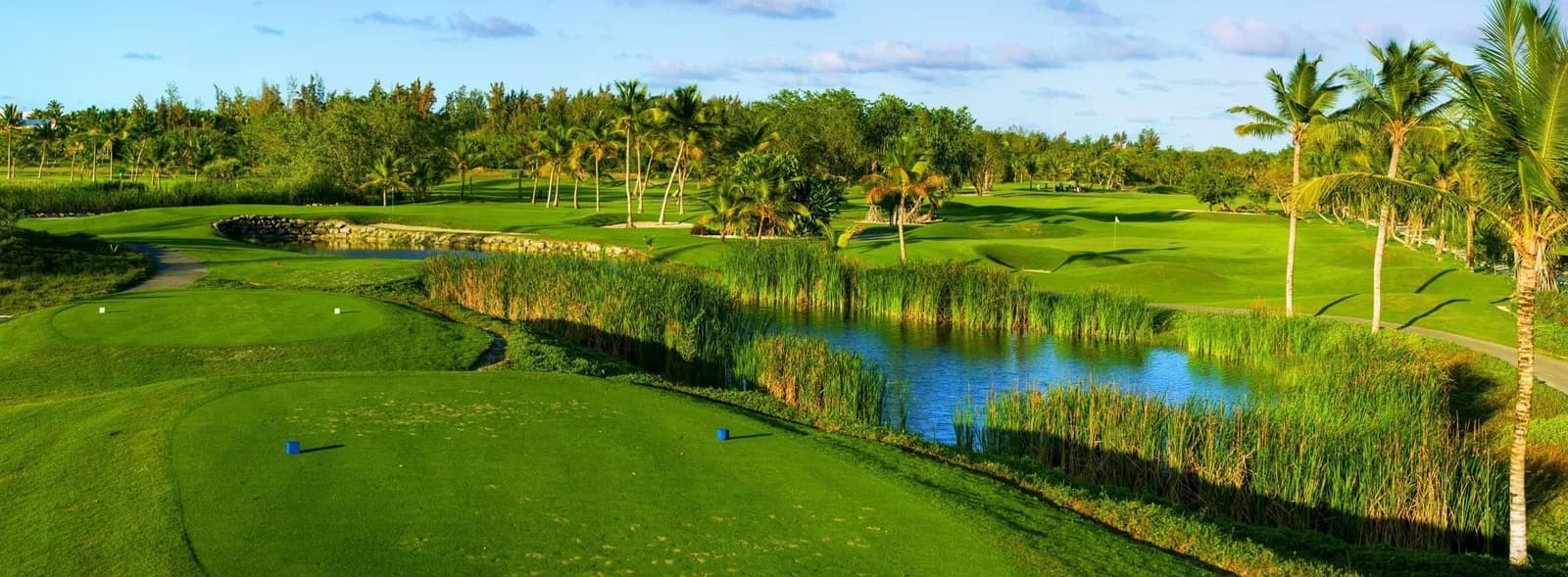 Slatted P.B. Dye bunker beside a lake and green at The Lakes Barceló