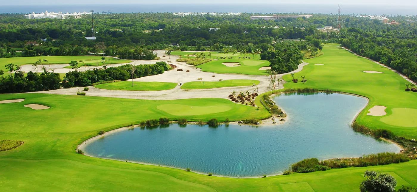 Aerial of Punta Blanca's lake-guarded holes with the Bávaro coastline on the horizon