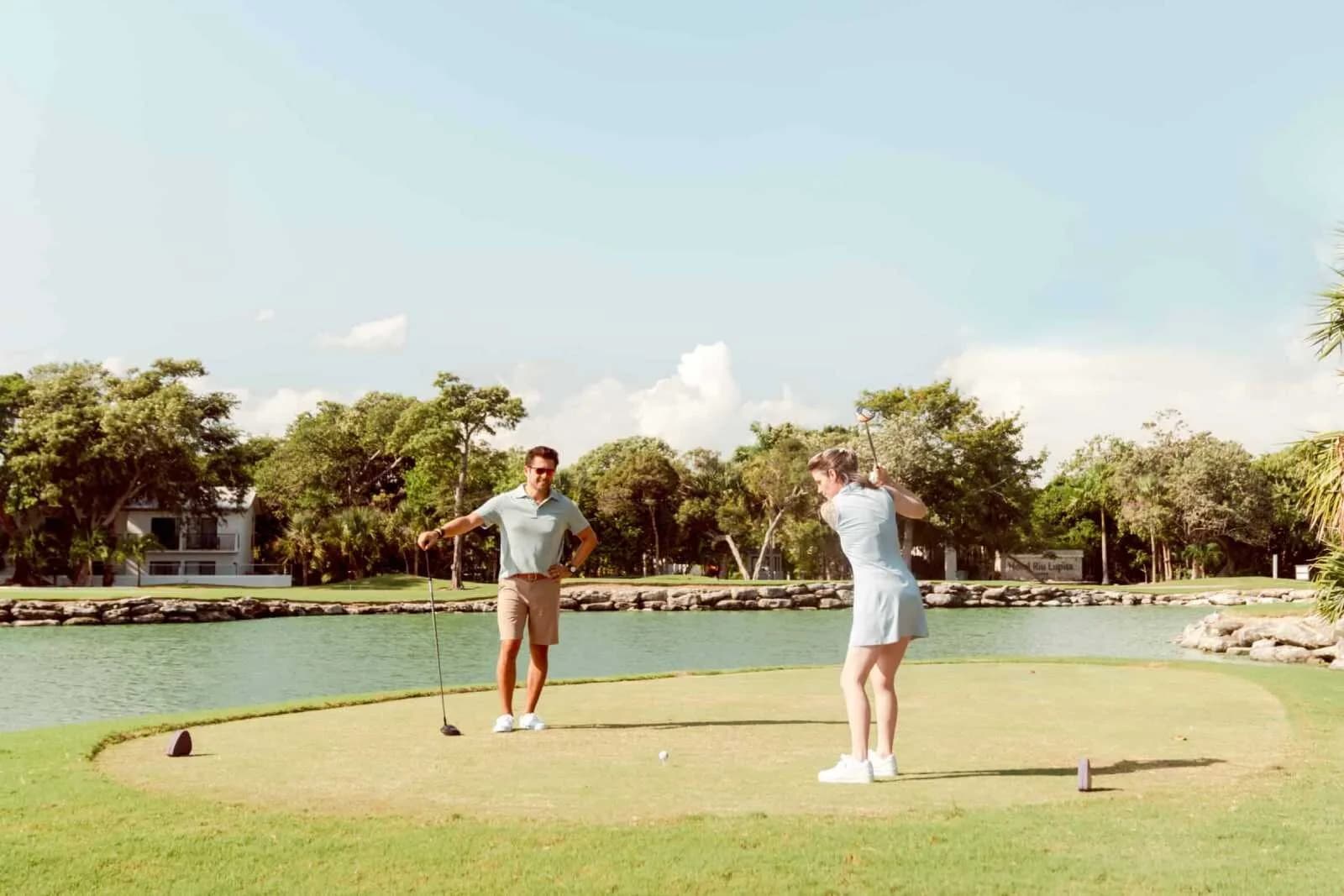 Tee shot over the lagoon through Playacar jungle at Hard Rock Golf Club Riviera Maya