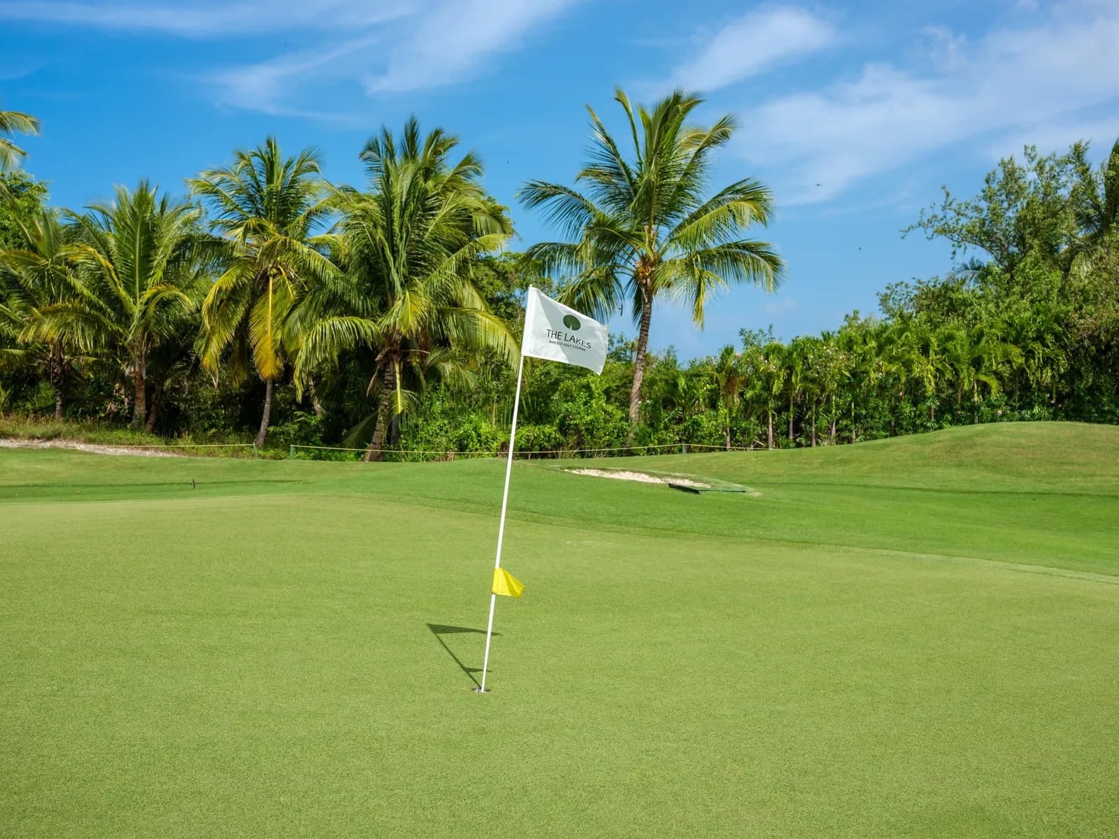 Slatted P.B. Dye bunker beside a lake and green at The Lakes Barceló