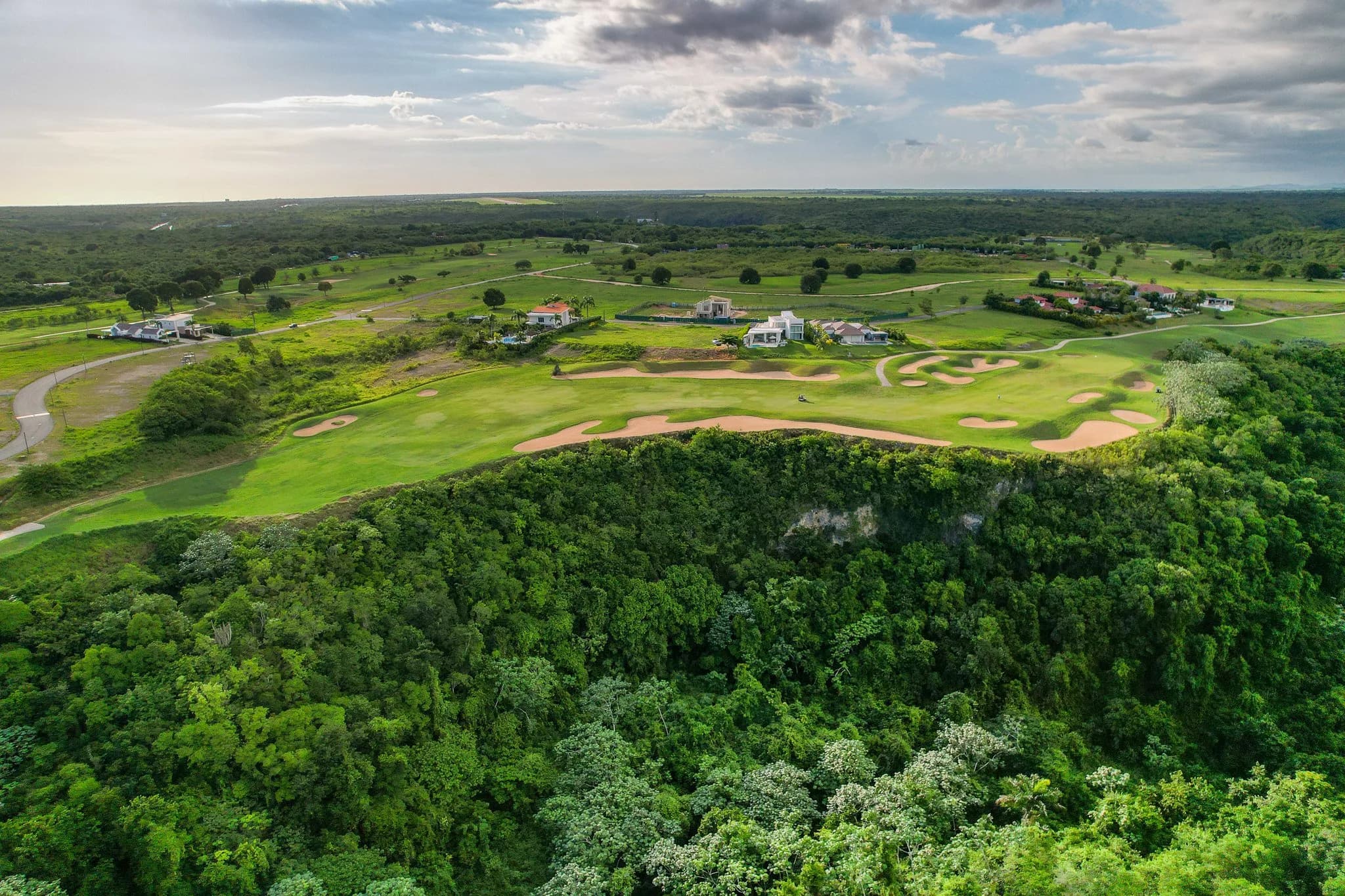 Drone view of La Estancia fairways along the Chavón canyon rim