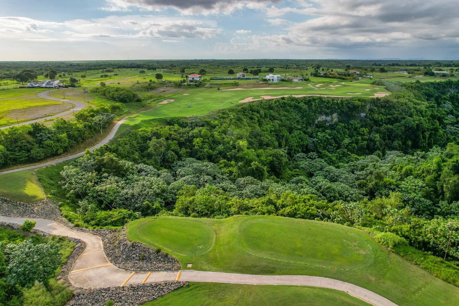 Drone view of La Estancia fairways along the Chavón canyon rim