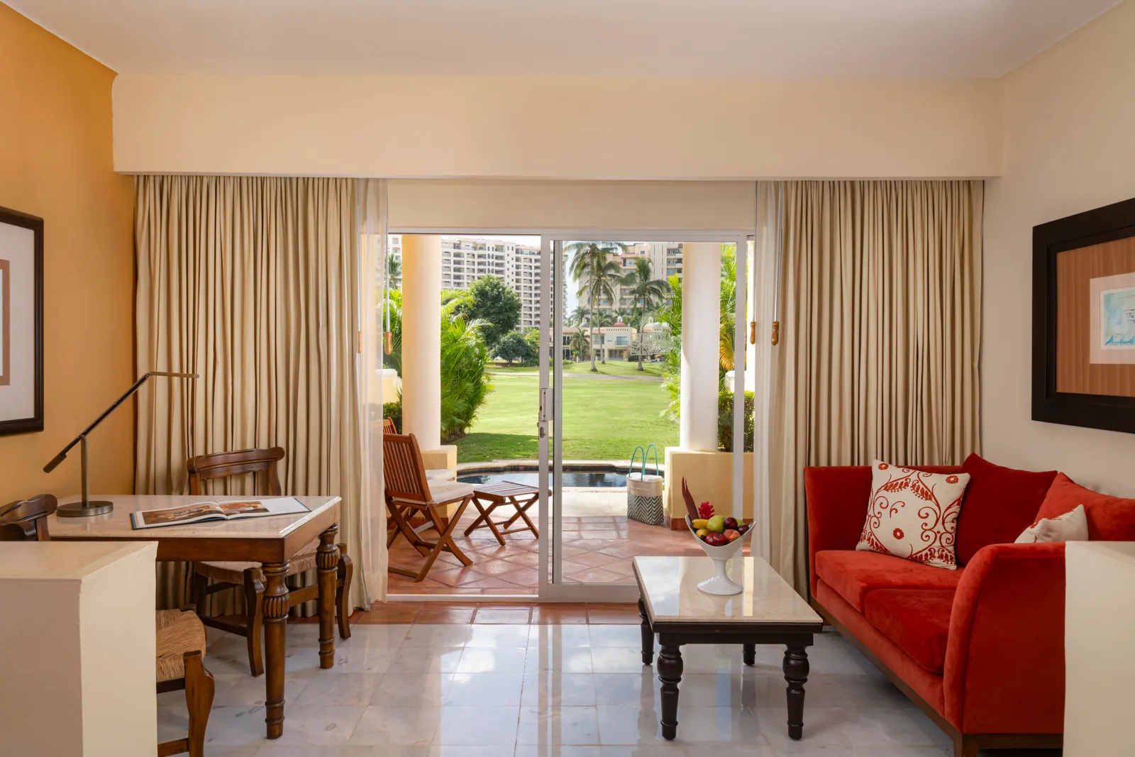 The Grand Class suites open through sliding doors to a private plunge pool, the fairway just beyond.