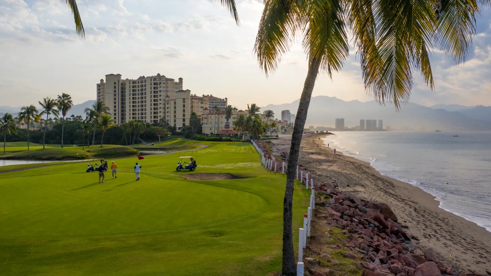 The stretch along the beach at Marina Vallarta — surf on your right, the town waking up ahead.